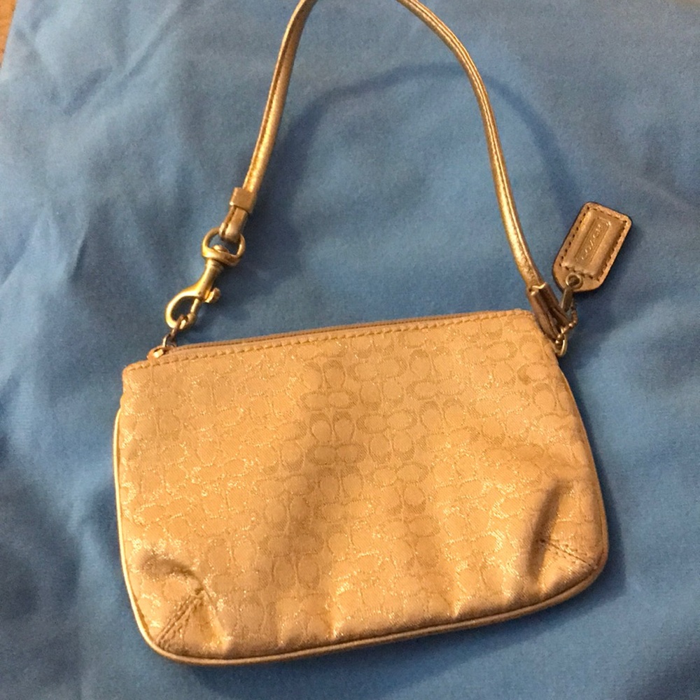Gold Coach monogram wristlet